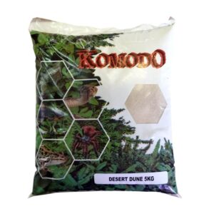 Komodo Desert Dune 5kg white sand for reptiles in packaging with vibrant green background and reptile images.