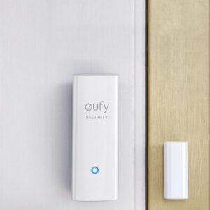 eufy Security Smart Entry Sensor installed on a door frame, featuring a compact design for monitoring doors and windows.