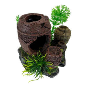 Aquarium ornament jars with plants atop rock formation, enhancing underwater beauty.