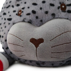 Close-up of the Jolly Jumbo Seal plush toy's face, featuring soft gray fabric and playful facial details.