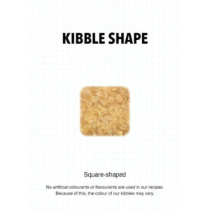Square-shaped kibble piece for Ultra Dog Superwoof dog food, highlighting natural ingredients and no artificial additives.
